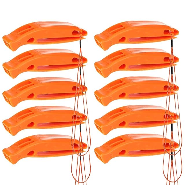 Bramble ten-pack of signal whistles with cords laid out together