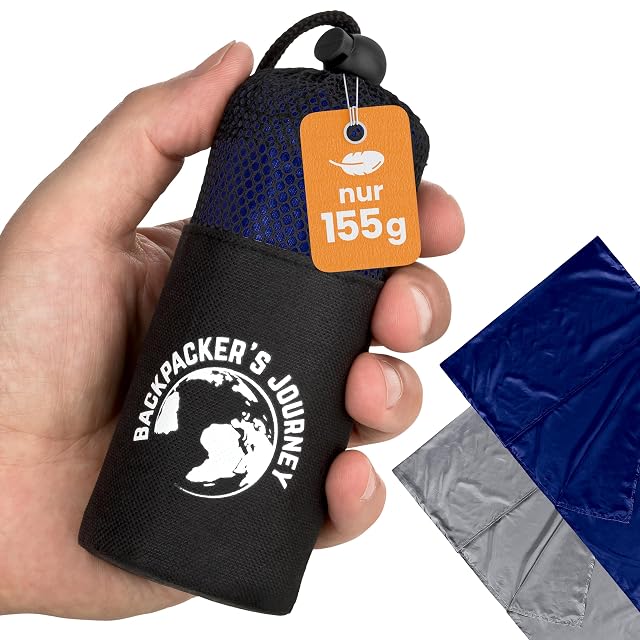 Backpacker's Journey blue microfibre sleeping bag liner beside its compression sack