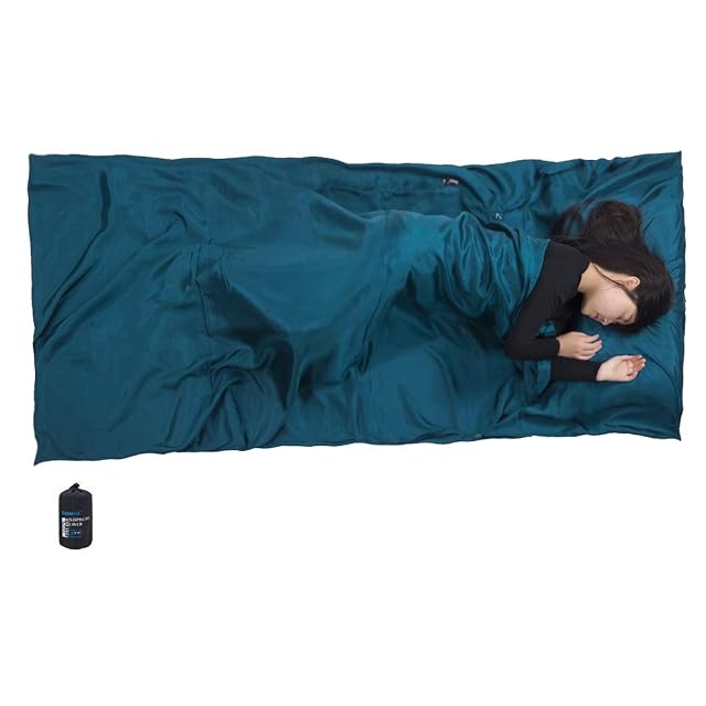 BROWINT mulberry silk sleeping bag liner folded beside its nylon stuff sack